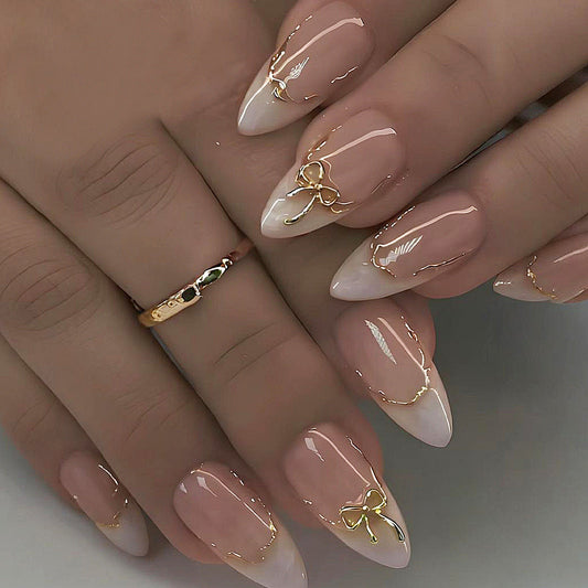 Elegant Stiletto Press-On Nails – Nude & White French Tips with Gold Bow Accent Nails