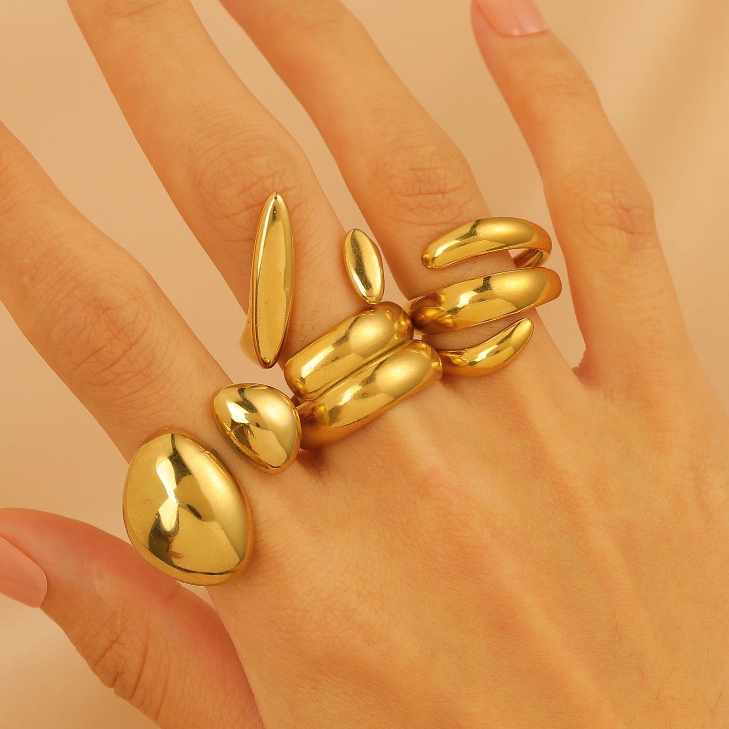 Set of 4 Bold Gold Stainless Steel Rings – Adjustable Water Drop Statement Jewelry