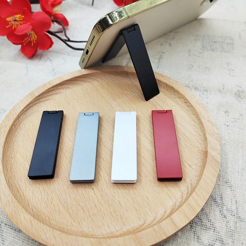 One-line folding mobile phone stand desktop invisible back sticker metal lazy stand adhesive small mini sticker