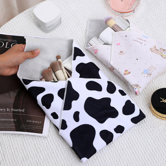 Foldable Multi-Purpose Storage Bag – Cow Pattern Travel Organizer for Cosmetics, Tablets & Daily Essentials