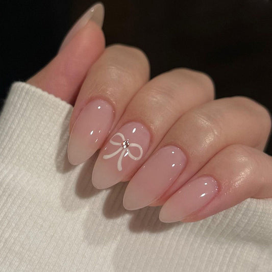 Elegant Pink Press-On Nails – Almond with White Bow & Rhinestone Accent